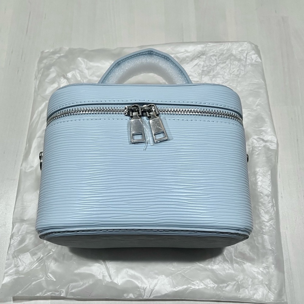 Bloomingdale’s Light Blue cosmetic bag /vanity case with strap